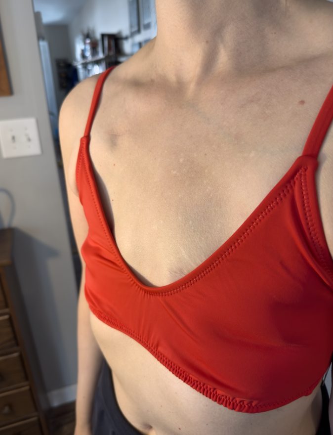 Fit reference image, swim top side profile. Research artifact.